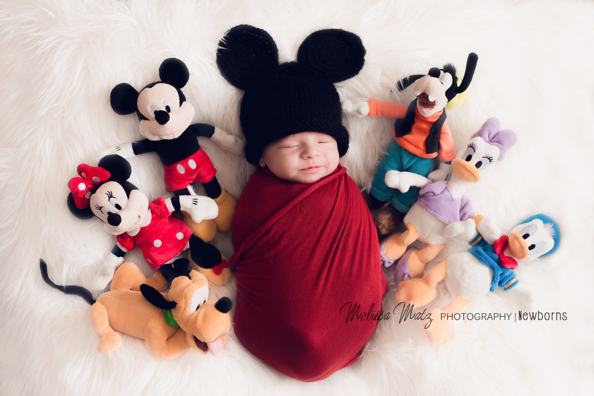 newborn baby boy dressed as mickey mouse