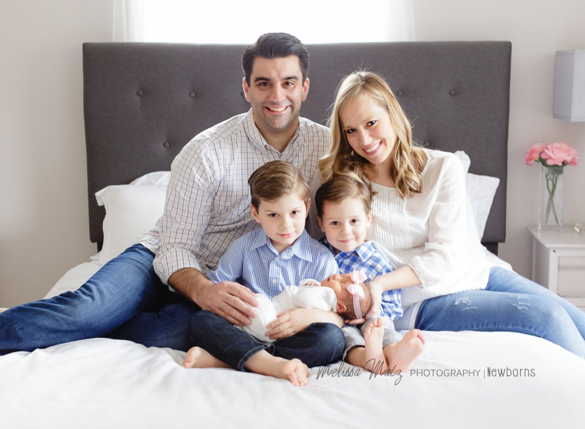family together for newborn baby photo session 