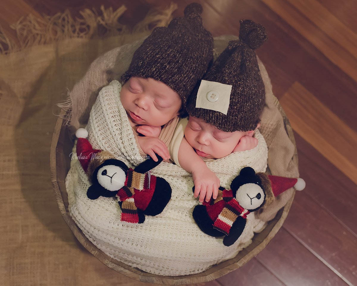 twin newborn baby boys cuddled up with teddy bears photo session oakland county mi