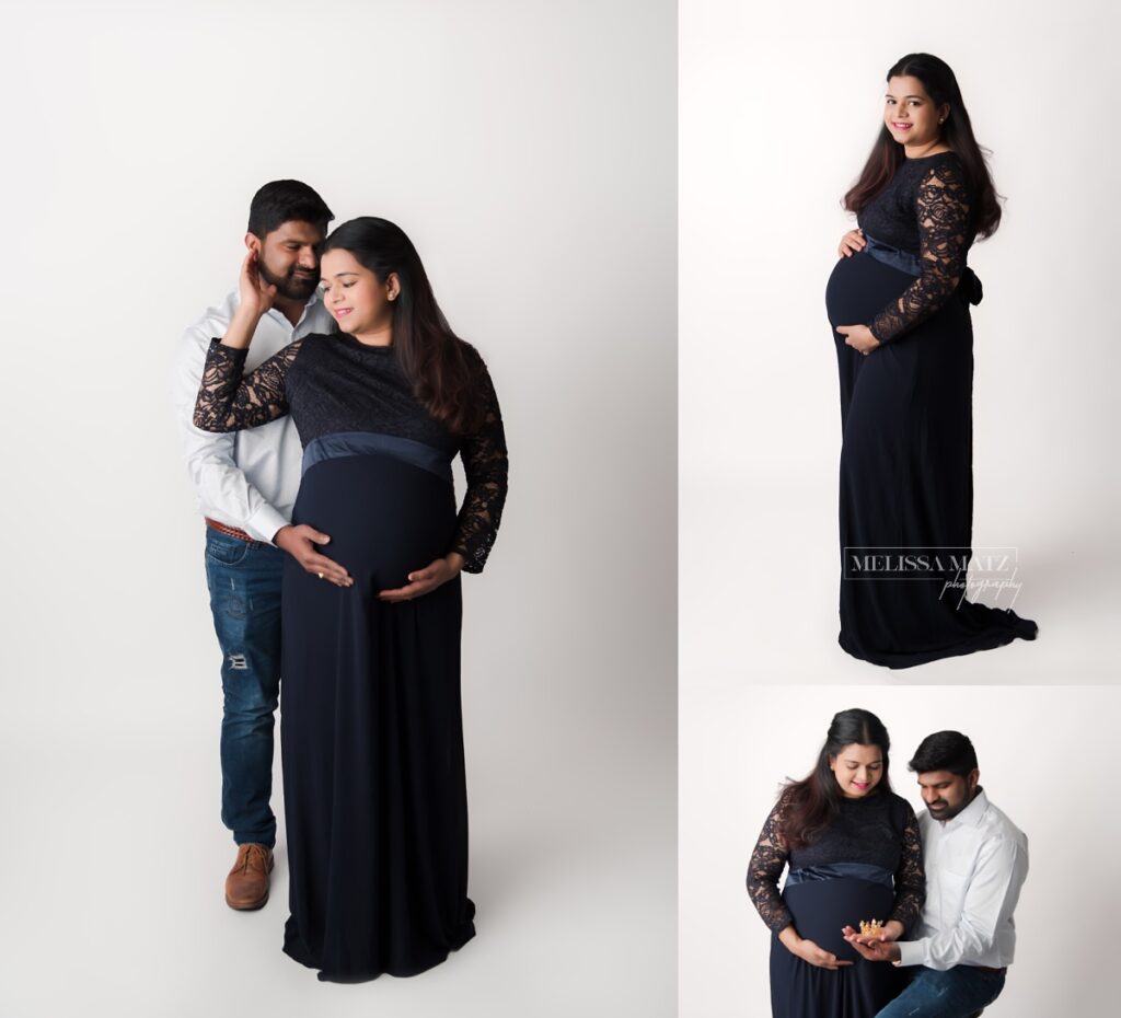 parents to be at their maternity photo session with mom in a black gown holding a tiny crown