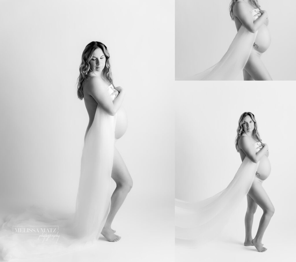 white fabric draped across mom to be showing her growing baby bump for maternity portraits in macomb county mi photo studio