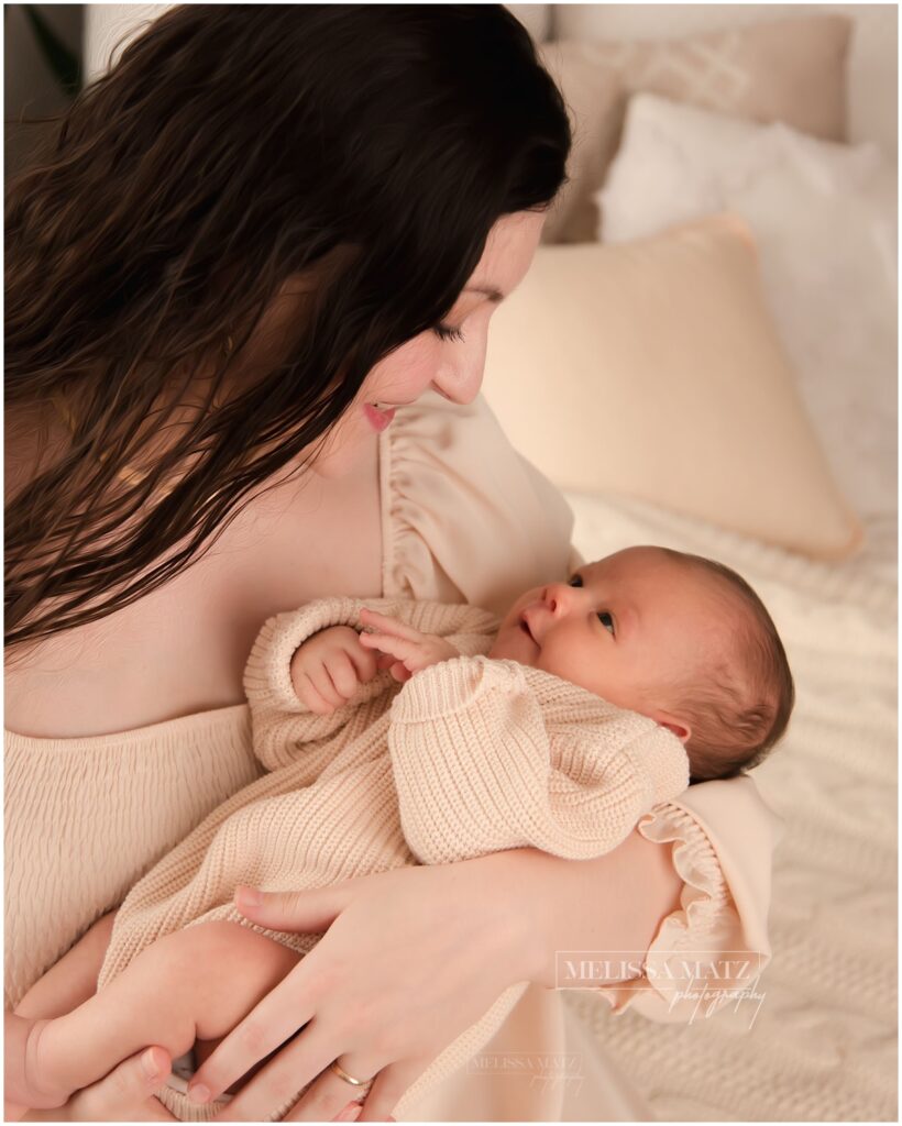 shelby township mi newborn photographer mom and baby looking into each others eyes