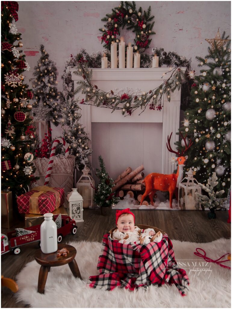 metro detroit photography studio set up for holiday sessions with a little one dressed in holiday pajamas