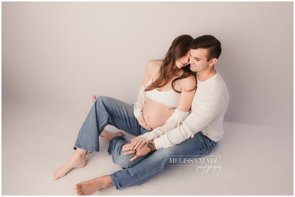 parents-to-be-photographed-during-their-maternity-session-at-shelby-township-mi-studio