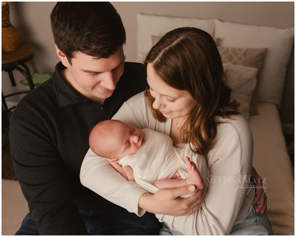 Classic side-lit newborn photo captured by Shelby Township newborn photographer