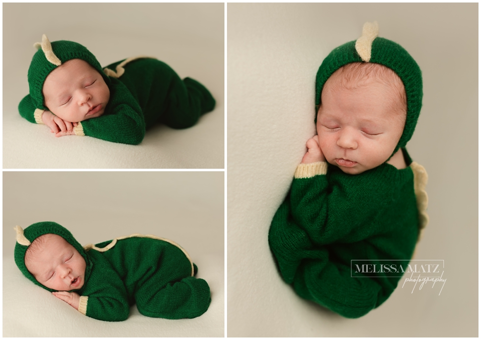 newborn baby in a dinosaur romper during his newborn session in macomb county mi