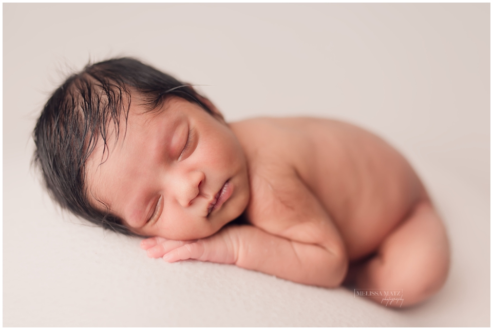 newborn baby sleeping during his newborn session in shelby township mi