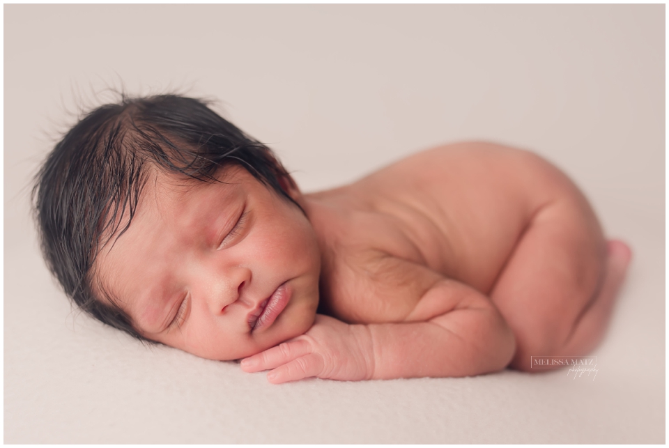 newborn baby sleeping during his photo session in macomb county mi