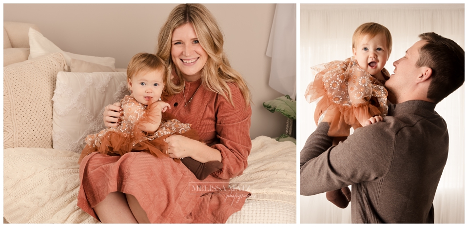 mom and dad snuggling their one year during their cake smash photo session