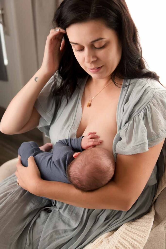 mom lovingly looking at her nursing baby during their mini session with melissa matz photography